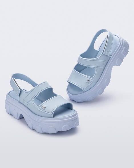 Angled view of a pair of blue Ella Move platform sandals.