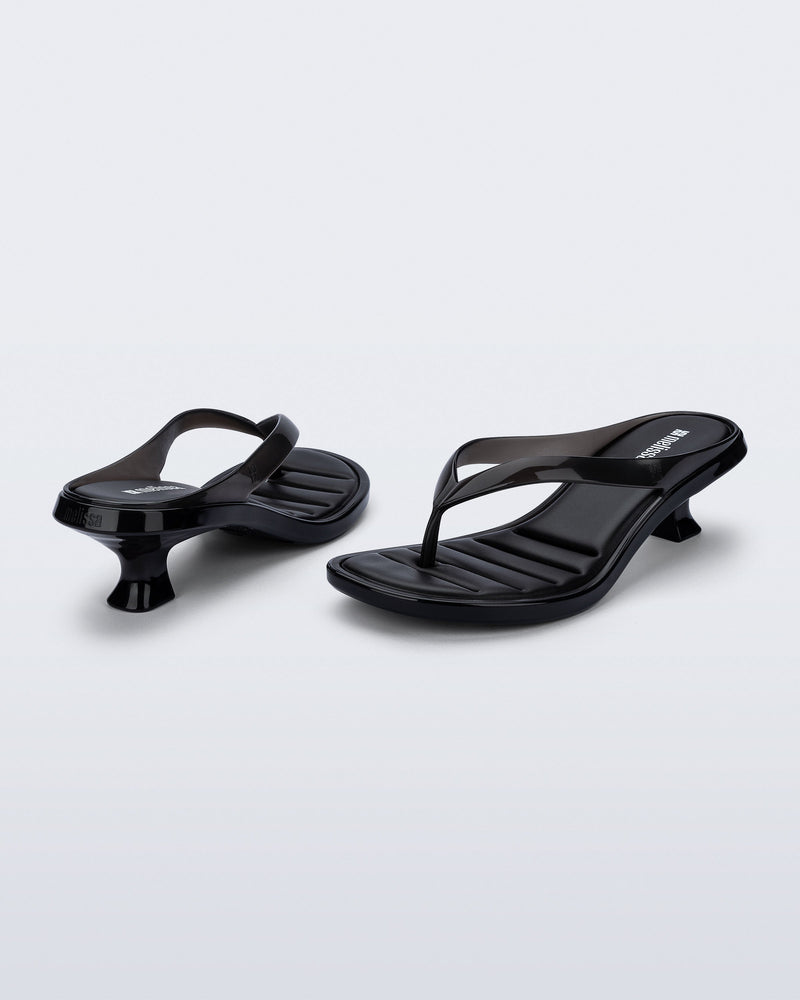 Back and angled view of a pair of black Flip Flop Kitten Heels