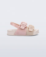 Side view of a pink/beige Cozy baby slide with two buckles