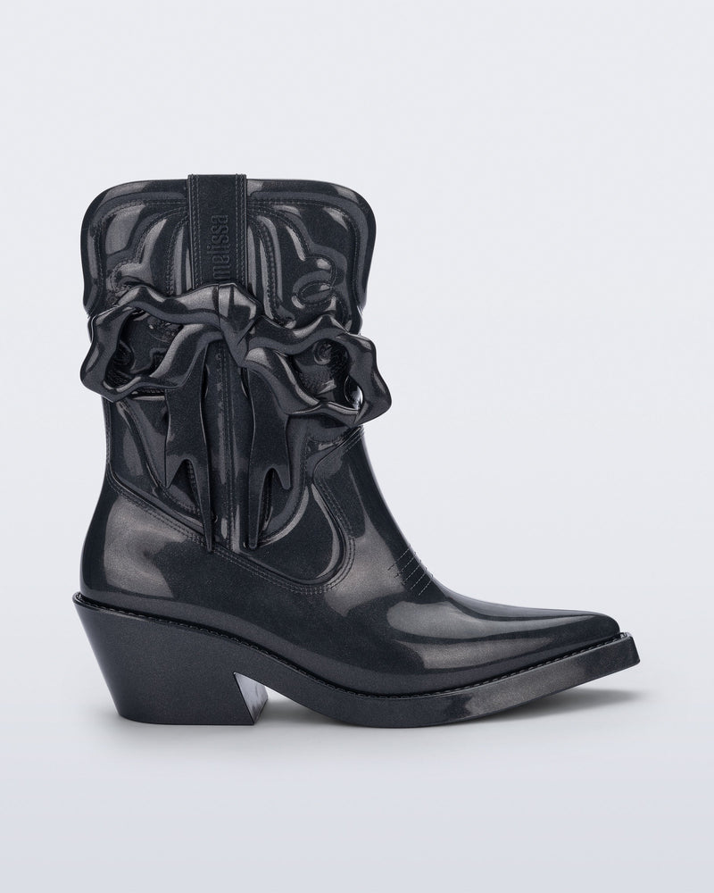 Side view of a metallic grey Texas + Maldito boot