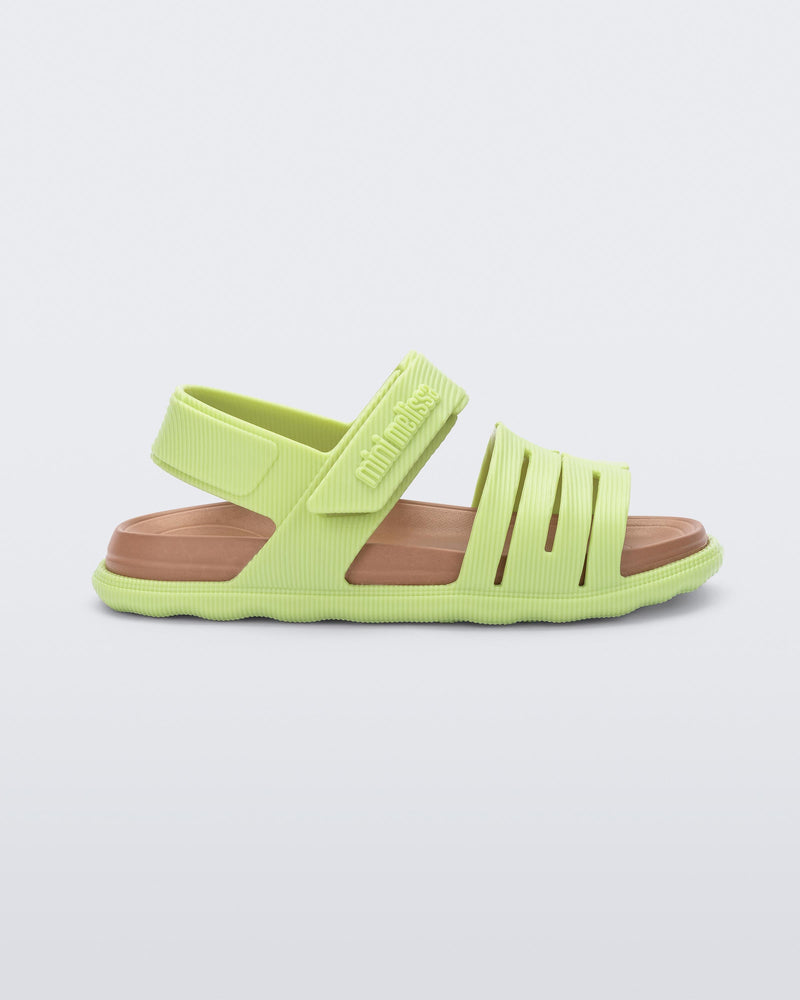 Side view of a green with brown insole Kaiteki baby sandal