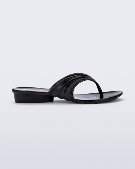 Side view of a black Flip Flop + Diesel sandals