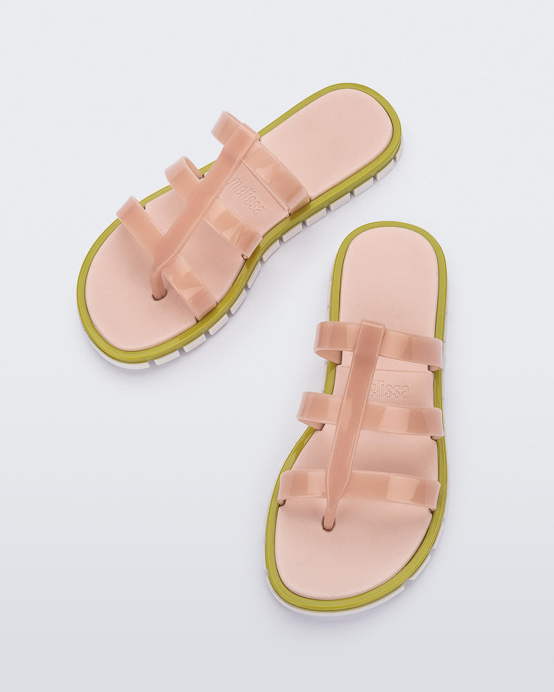 Top view of a pair of pink Path adult sandals with green sole