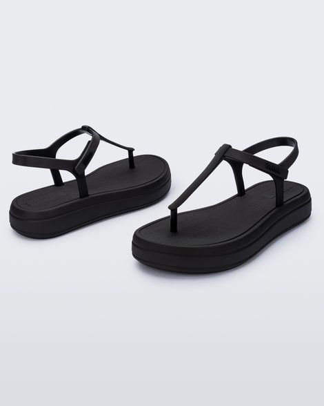 Angled and side view of a pair of black Sun Leme Platform sandals