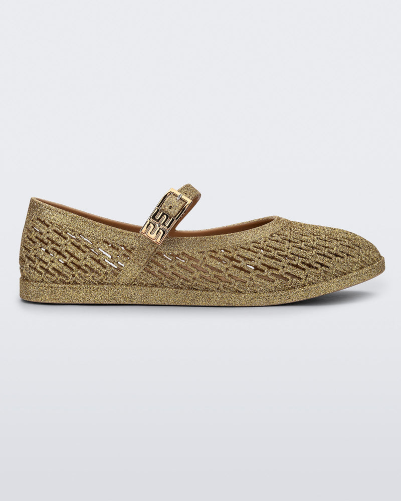 Side view of a beige glitter Harper flat with strap
