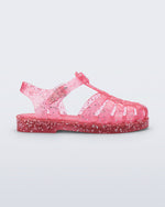Side view of a pink Possession kids sandal with heart glitter
