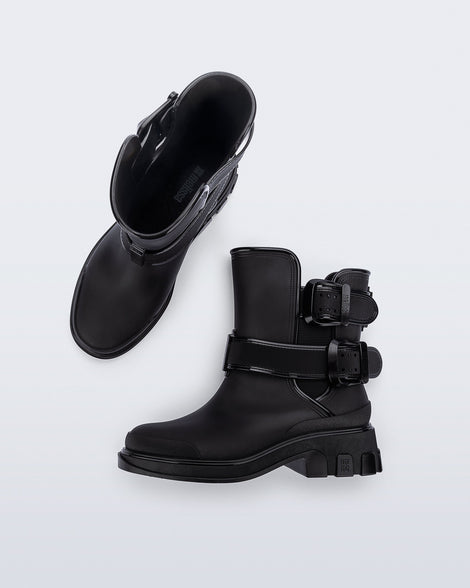 Top and side view of a pair of black Bang Boots with two side buckles