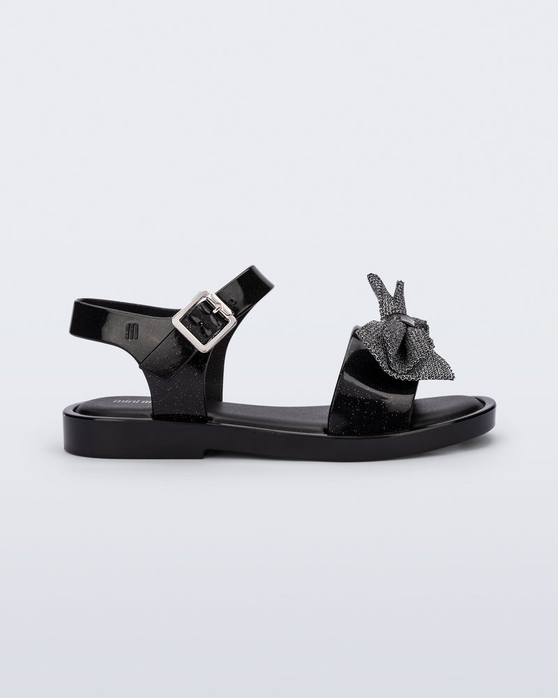 Side view of a glitter black Mar Sweet kids sandal
