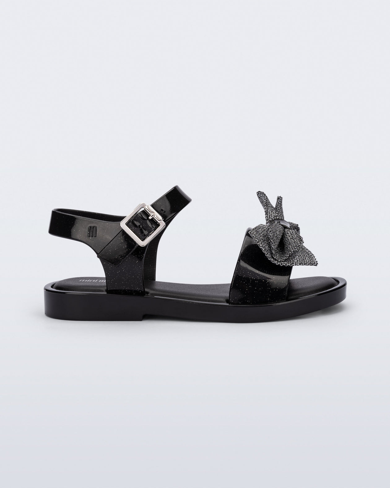 Side view of a glitter black Mar Sweet kids sandal