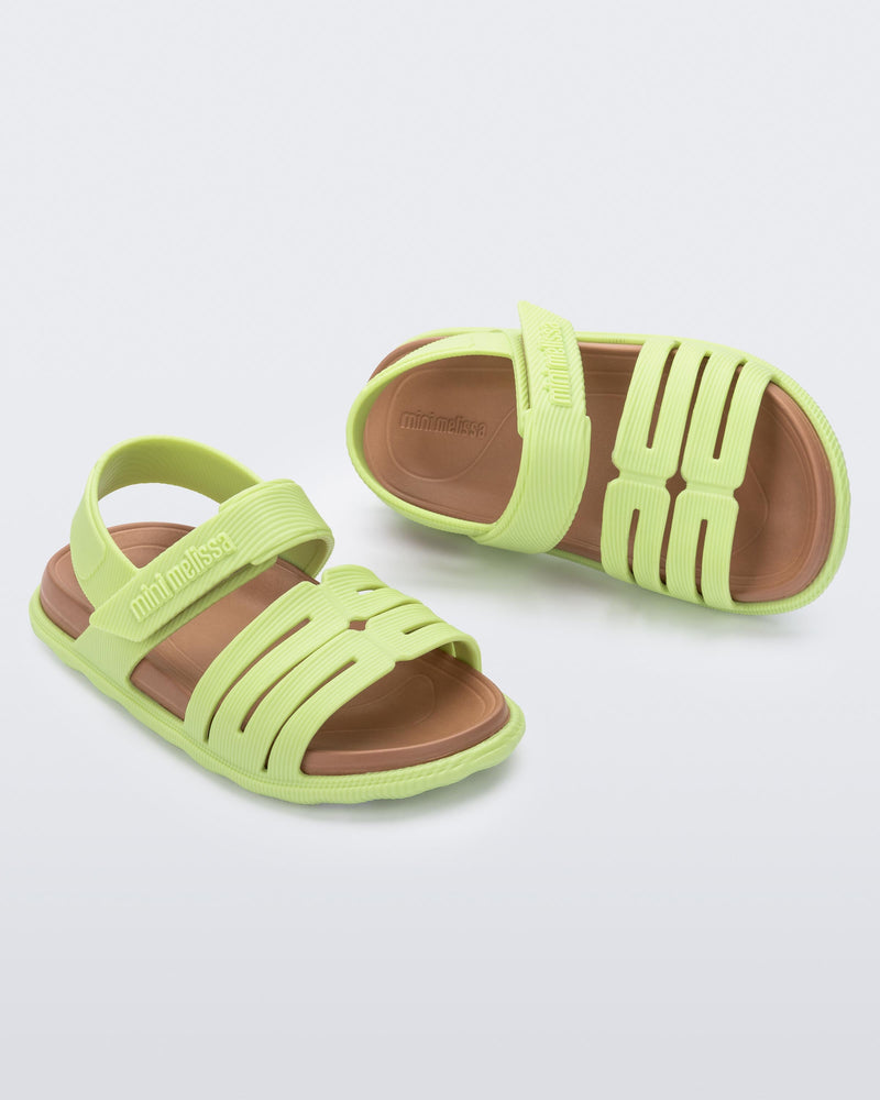 Top and angled view of a pair of green with brown insole Kaiteki baby sandals