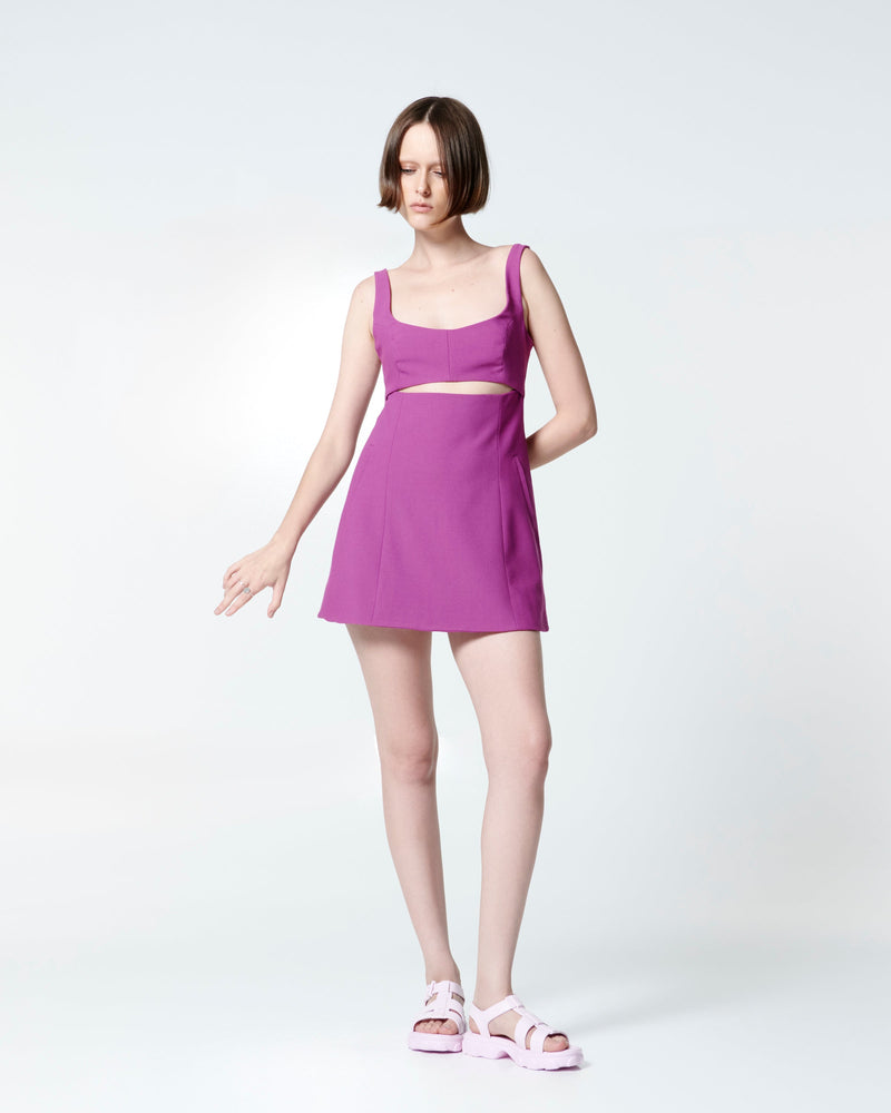 Model in a fuchsia dress wearing a pair of pink Ella sandals