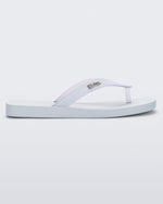 Side view of a white with clear glitter strap Sun Long Beach flip flop