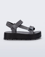 Side view of a black jean Flowing Denim platform