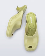 Top and side view of a pair of green Gaia kitten heels with peep toe