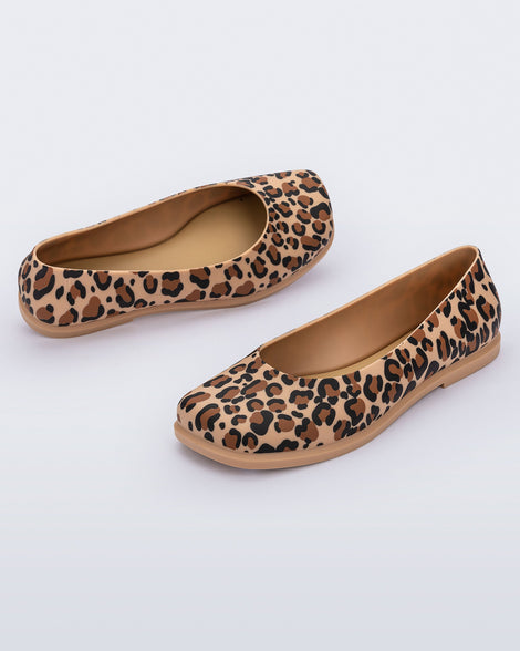 Angled view of a pair of brown Ruby adult flats with leopard spots