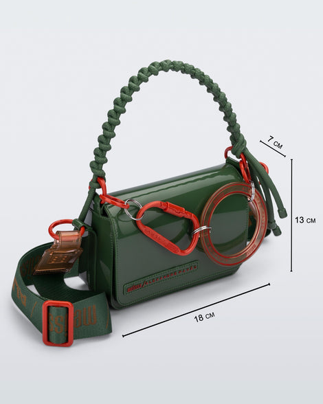Angled view of an dark green Olga Bag + Alexandre Pavao with short strap fabric long strap. With purse dimensions of 18cm x 7cm x 13cm