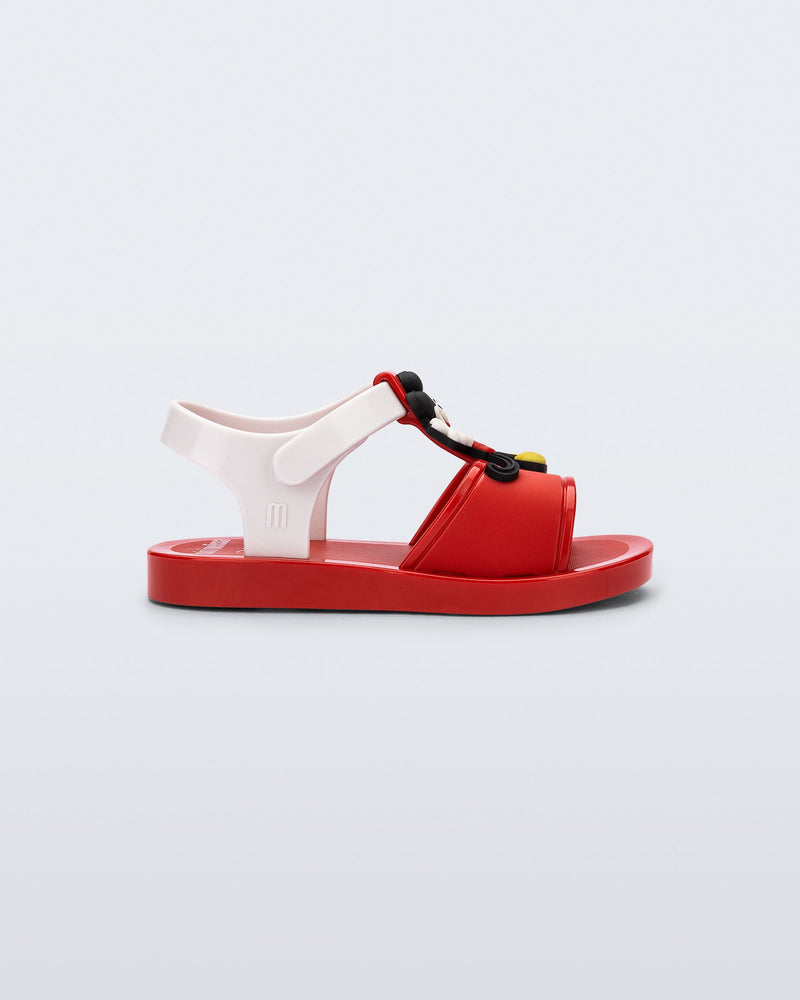 Side view of a red Play Mickey & Minnie sandals with white straps