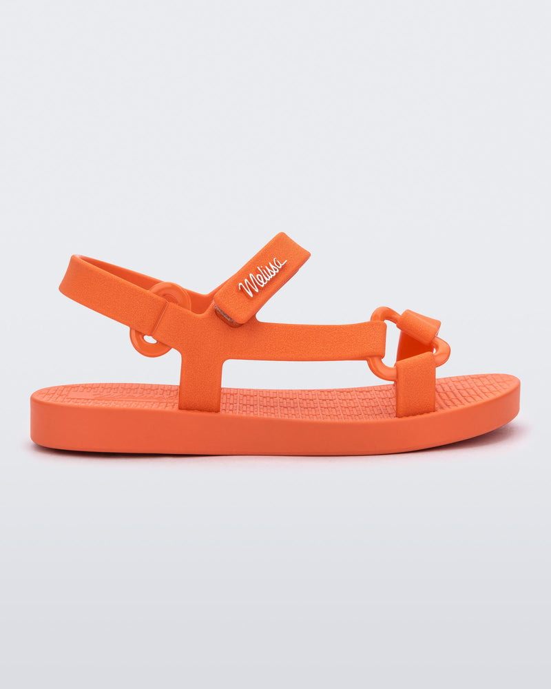 Side view of a orange Sun Downtown baby sandal