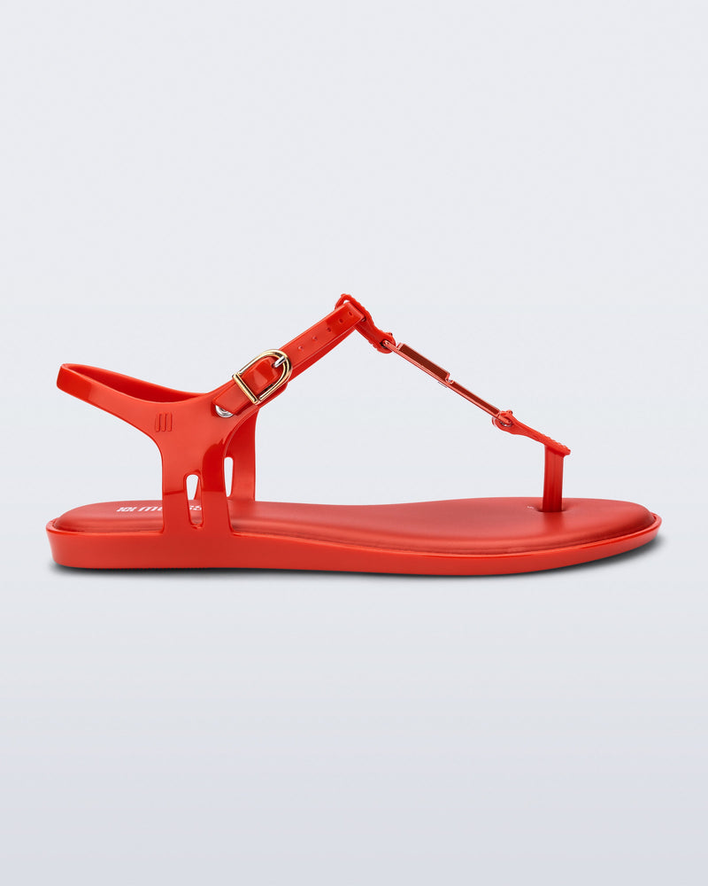 Side view of a red Solar M Chic sandal