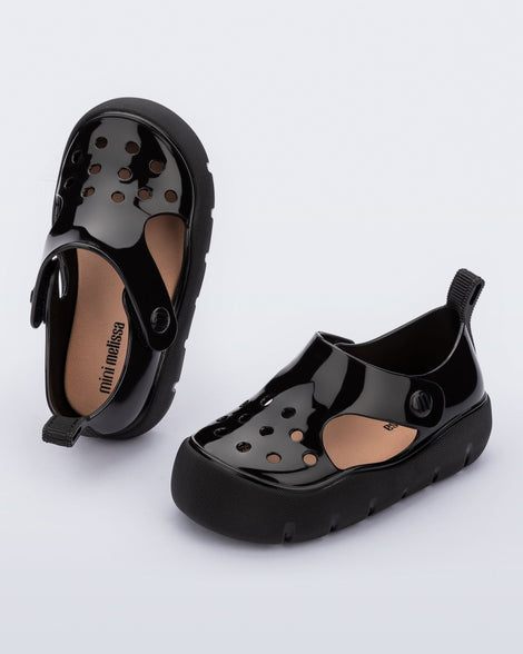 Top and angled view of a pair of black Bowie baby sandals.