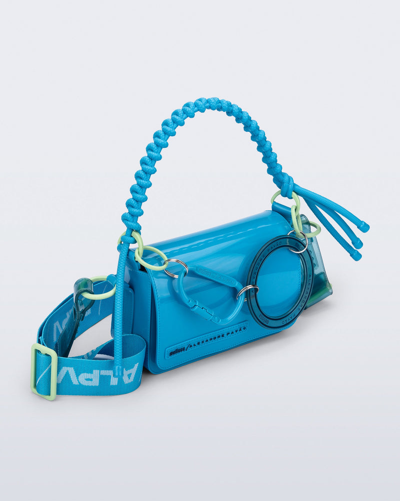 Angled view of an blue Olga Bag + Alexandre Pavao with short strap fabric long strap