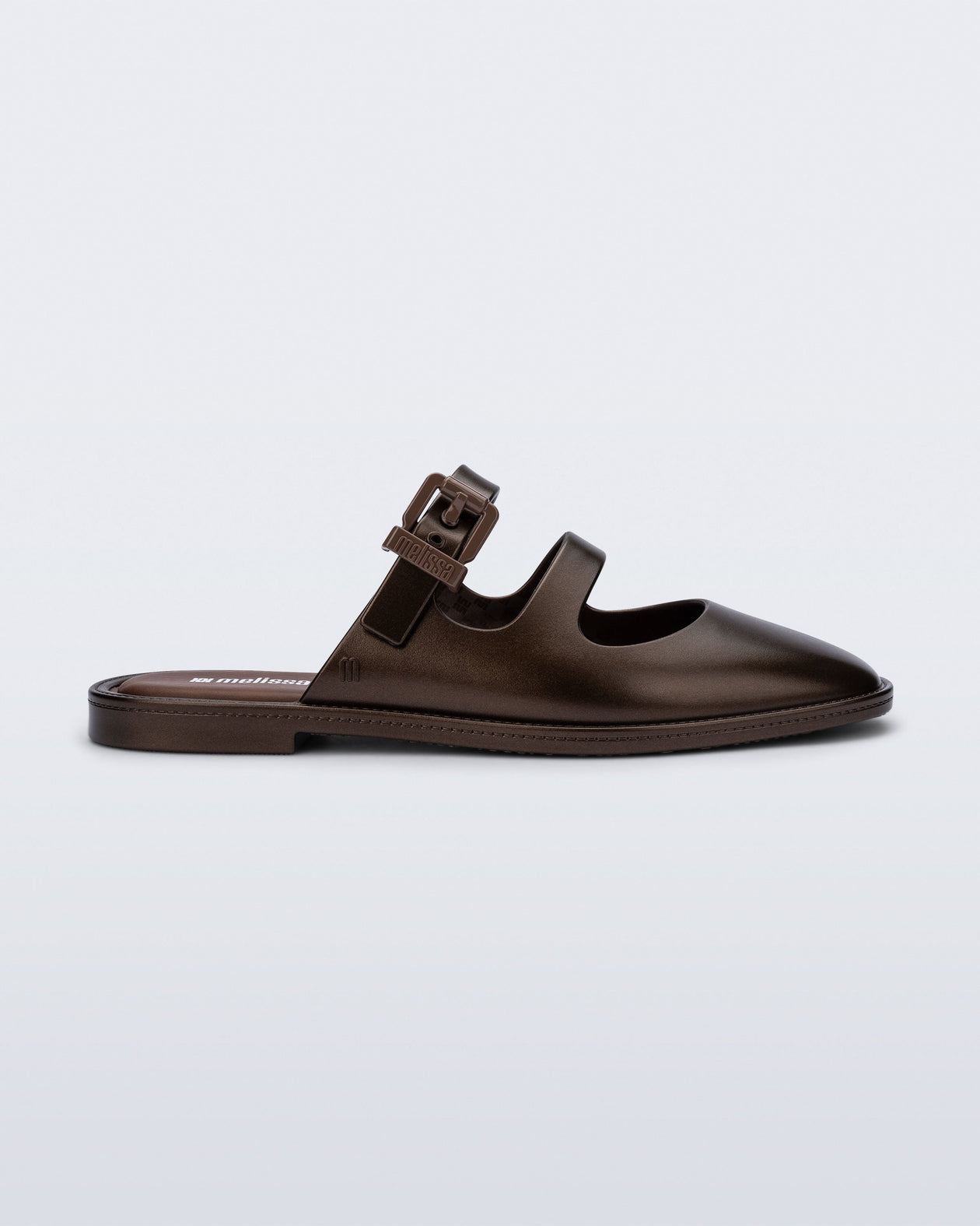 Side view of a bronze Anastasia mule slide with upper straps