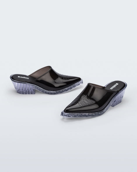 Side and angled view of a pair of black with clear heel Texas Mule heels