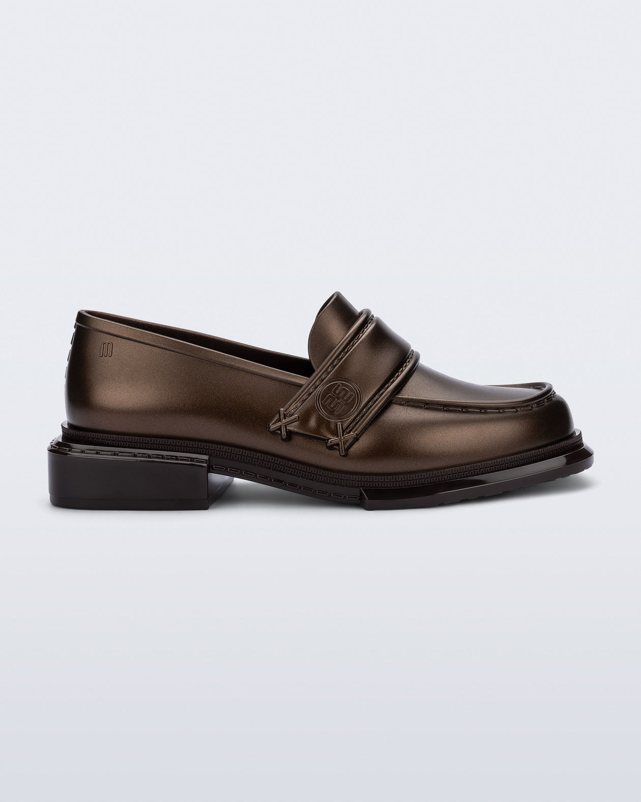 Side view of a bronze Spencer loafer