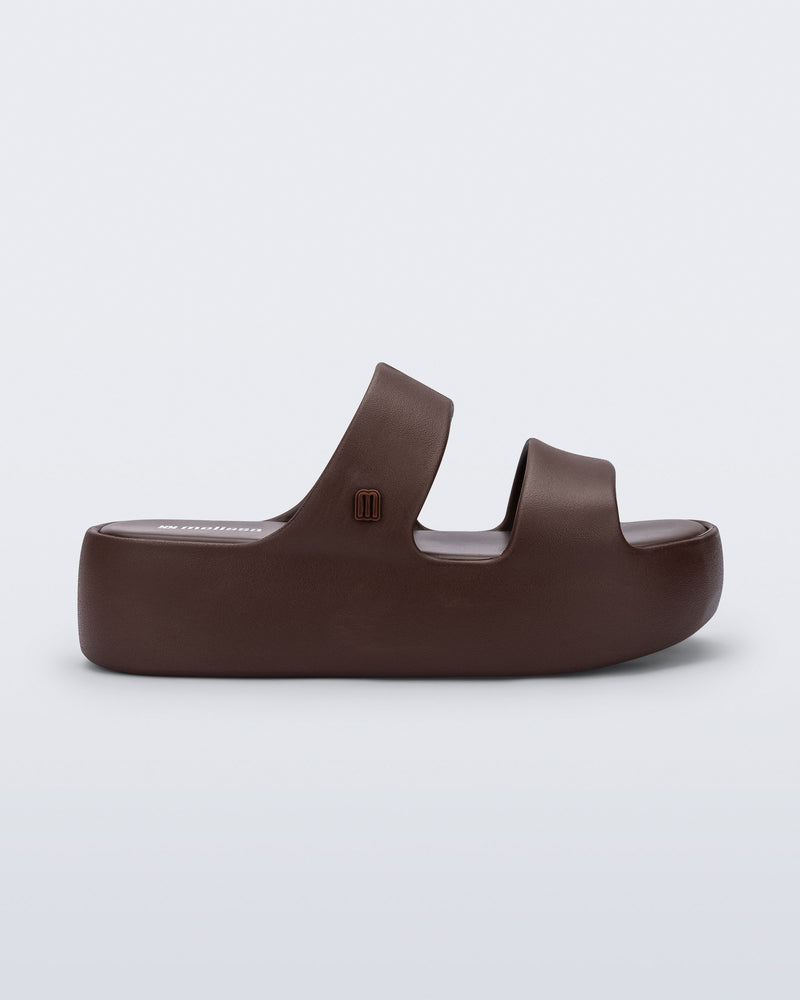 Side view of a brown Free Line Platform slide