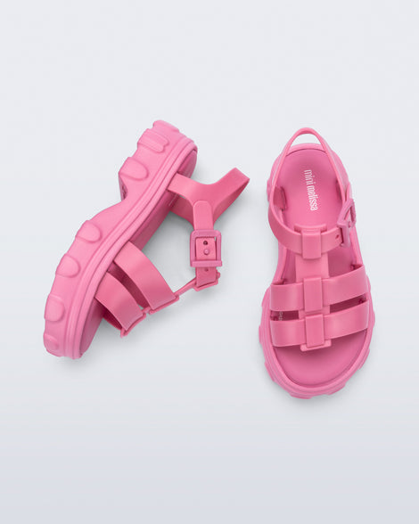 Top and side view of a pair of pink Ella kids sandals