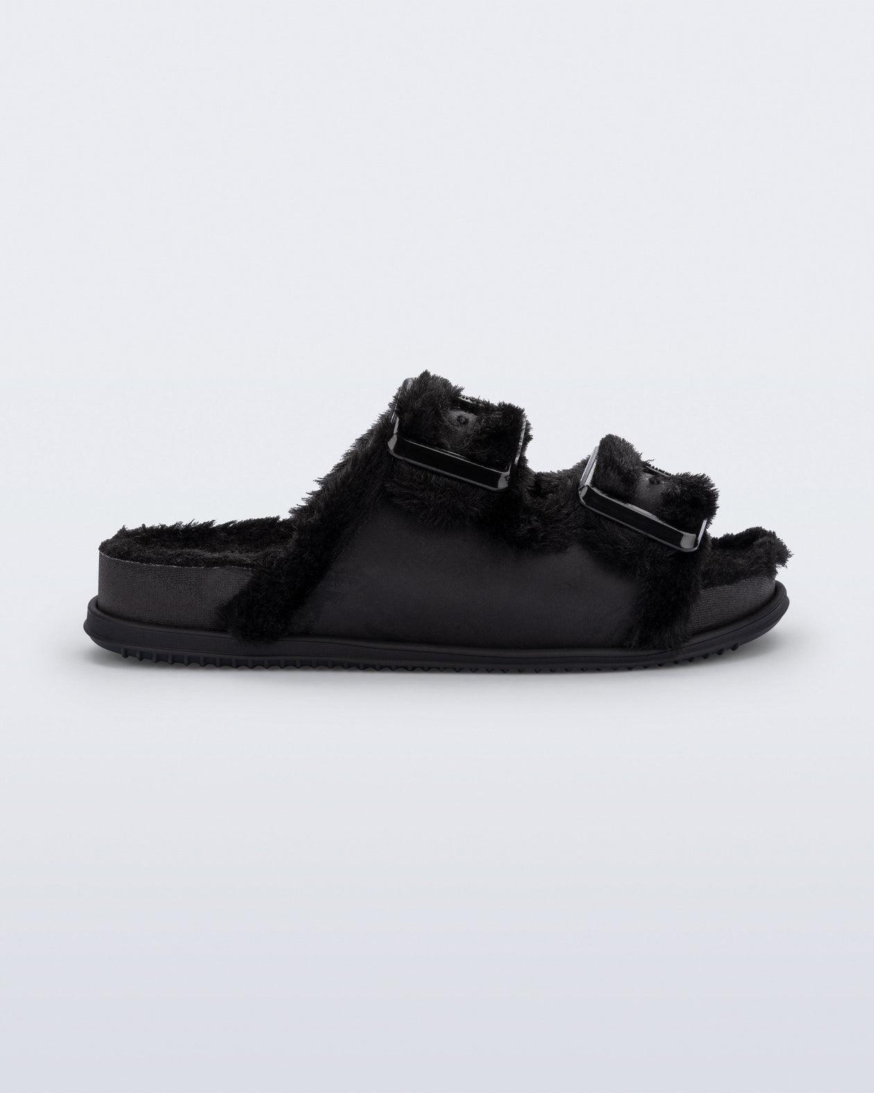Side view of a black Cozy Warm Slide with black fuzzy insole