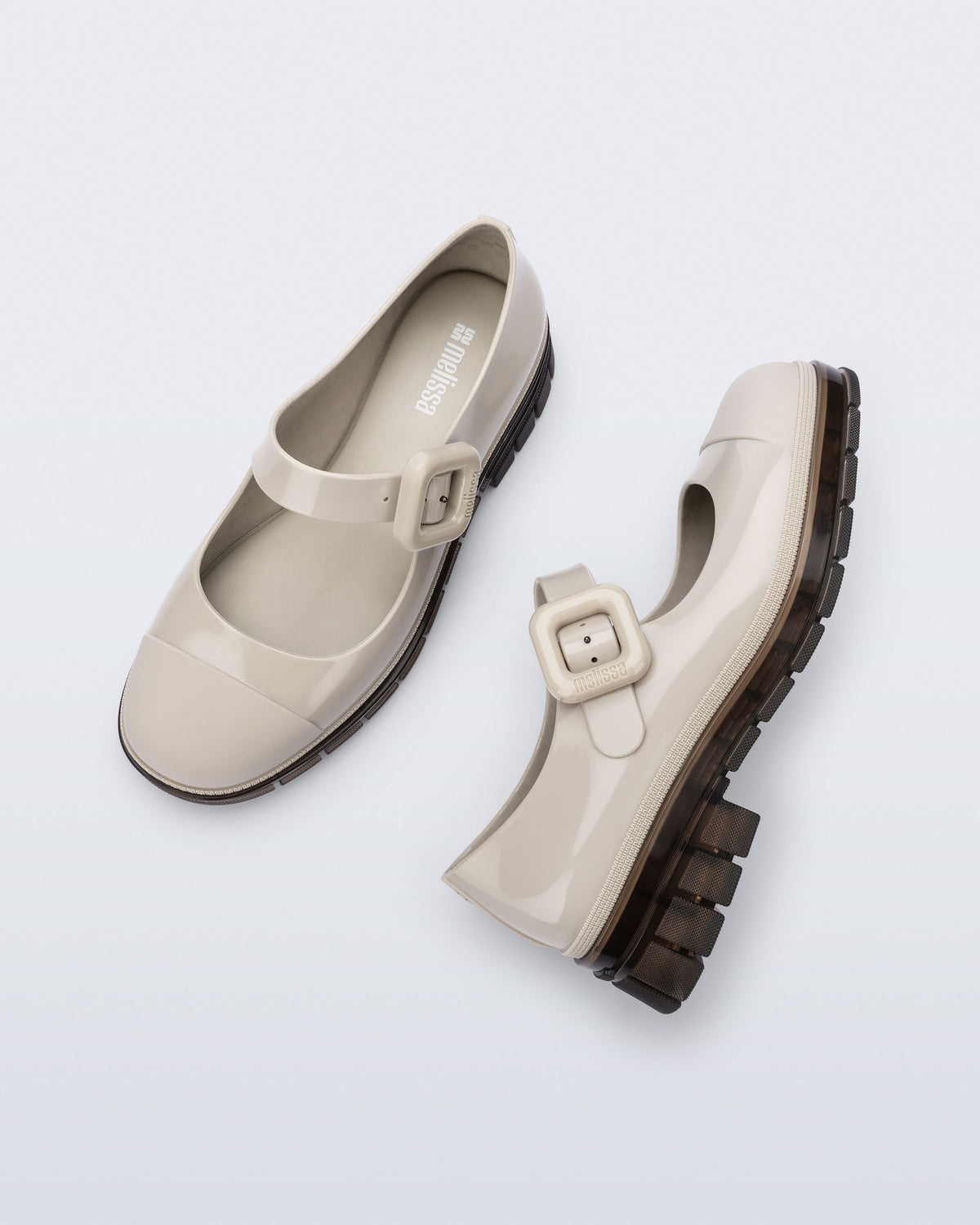 Top and side view of a pair of beige with brown sole June mary janes with matte toe cap