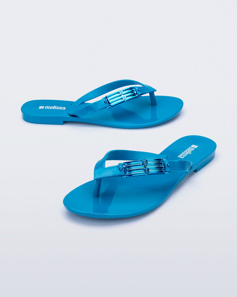 Side and angled view of a pair of blue Harmonic M Chic