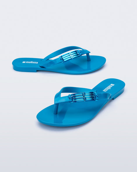 Side and angled view of a pair of blue Harmonic M Chic