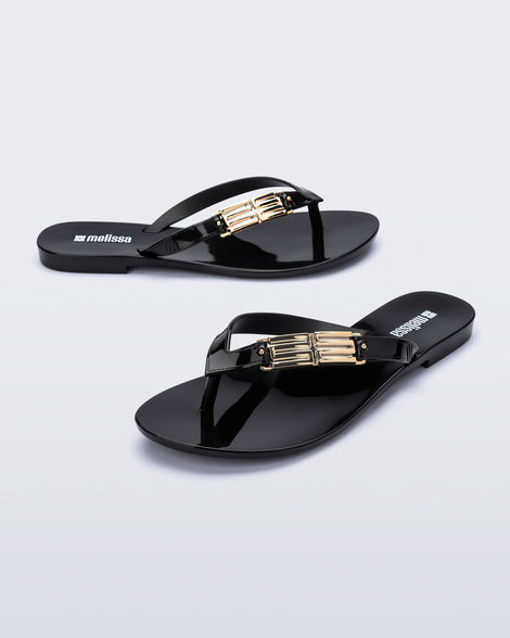 Side and angled view of a pair of black Harmonic M Chic