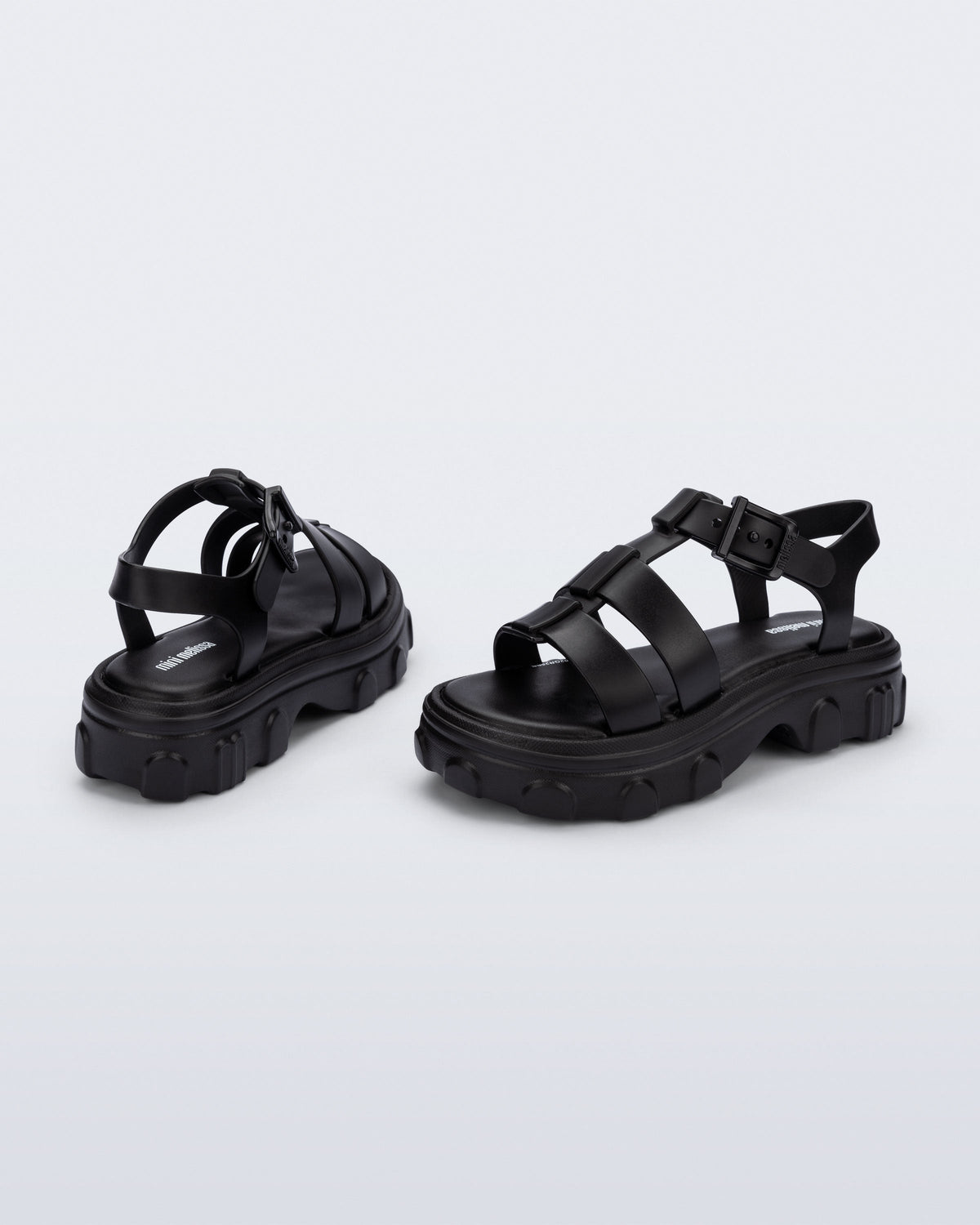 Back and side view of a pair of black Ella kids sandals