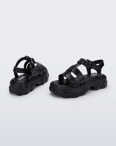Back and side view of a pair of black Ella kids sandals