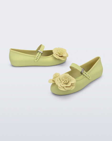 Angled and side view of a pair of green Soft Ballerina Petals flats