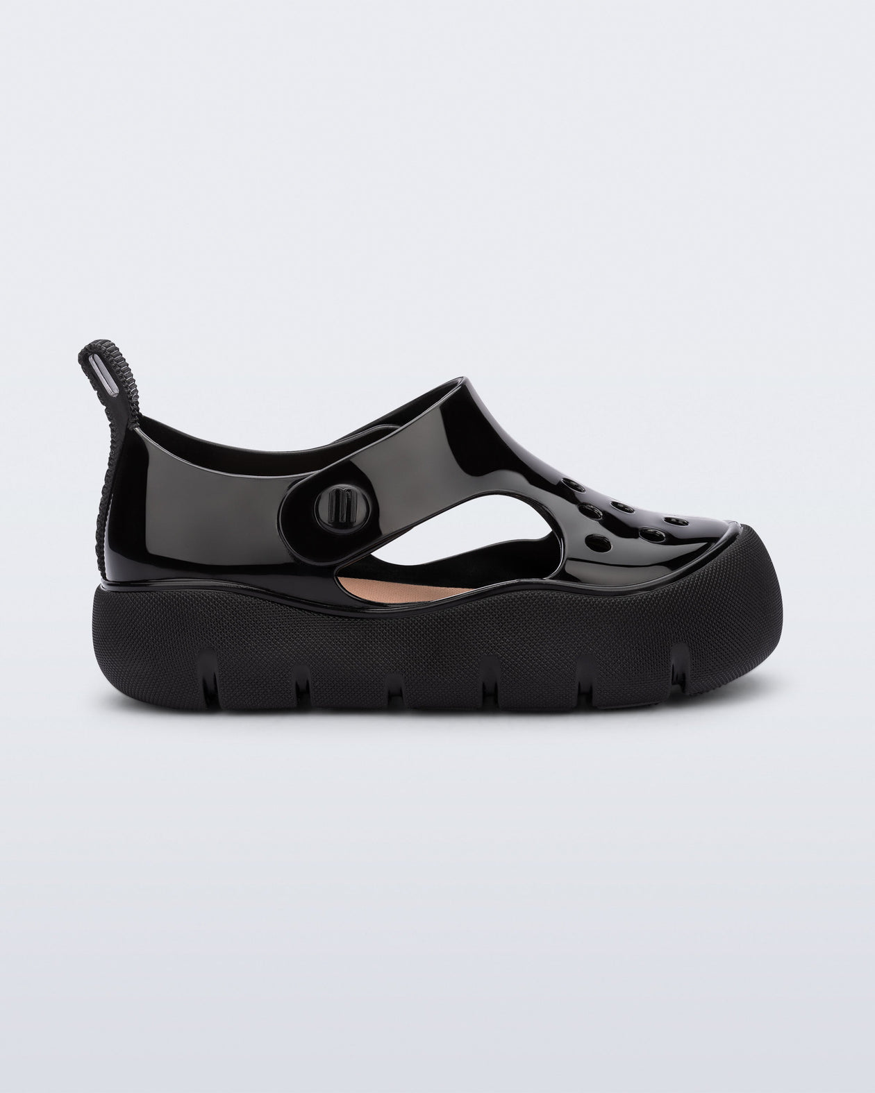 Side view of a black Bowie baby sandal.