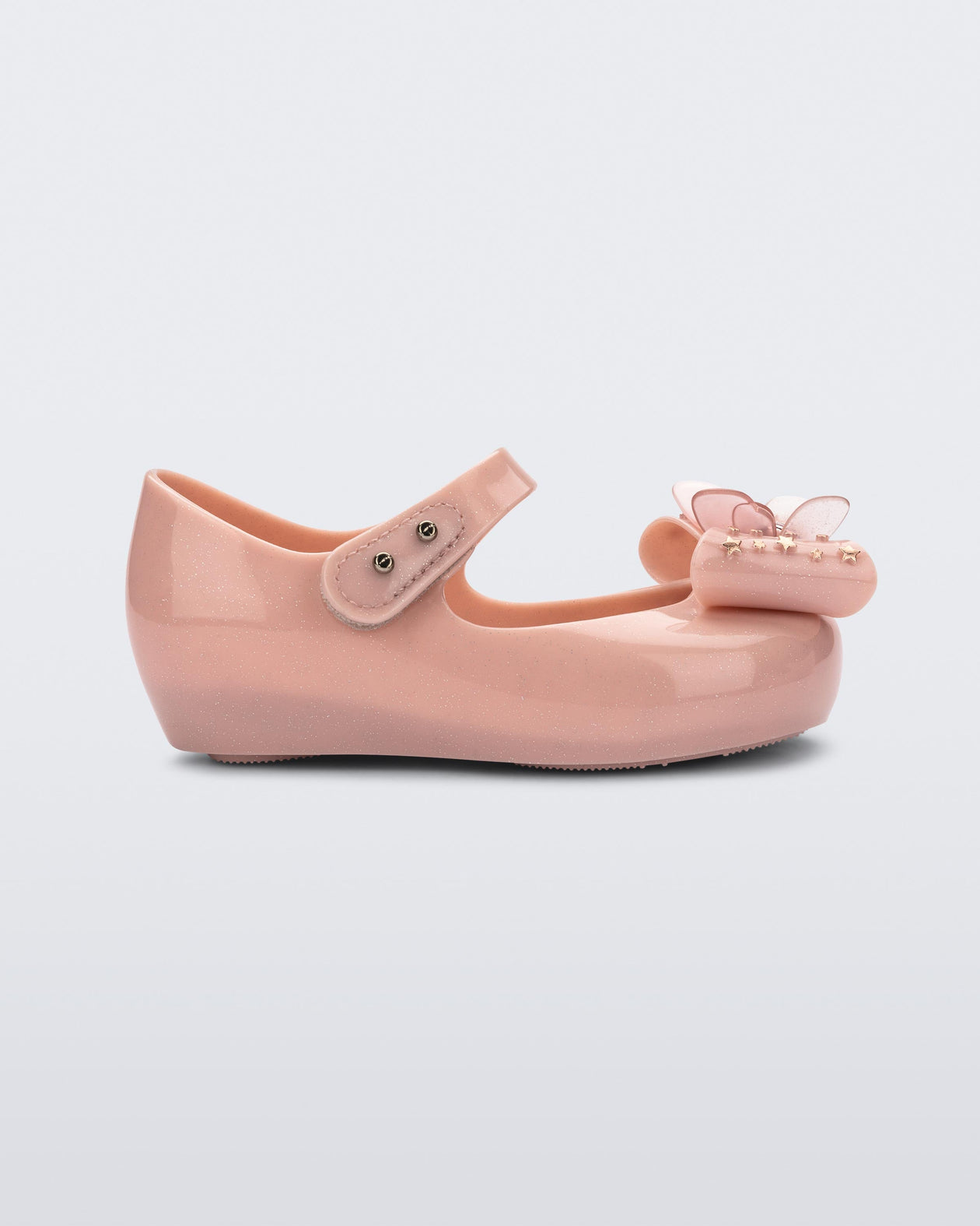 Side view of a Mini Melissa Ultragirl peeptoe ballet flat for baby in pink with star printed butterfly bow applique.