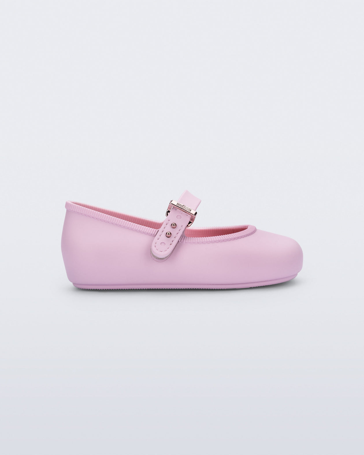 Side view of a pink Soft Ballerina baby flat with Velcro strap