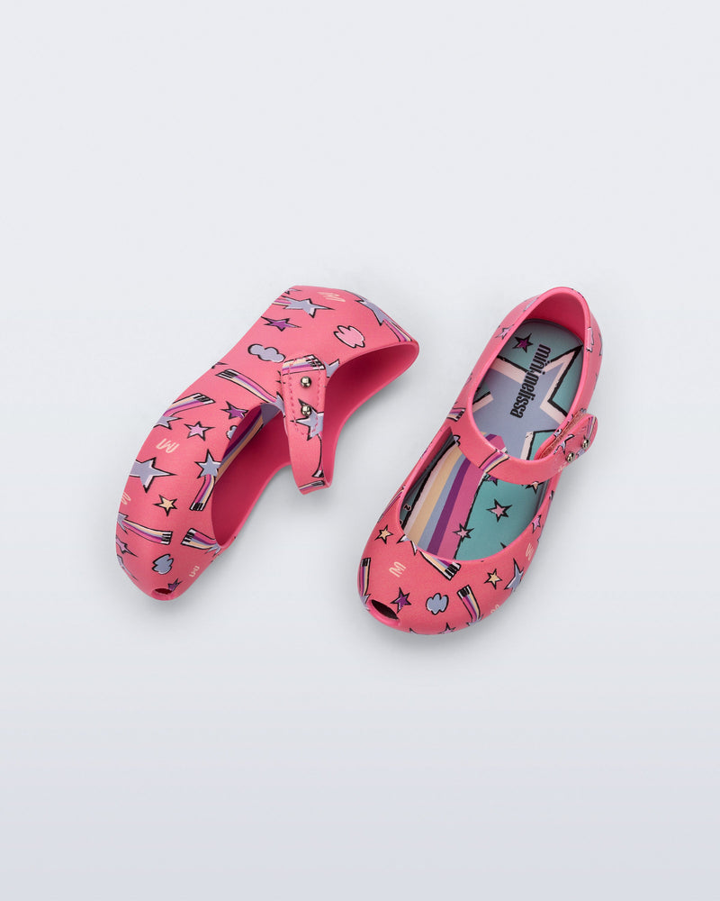 Top and side view of a pair of pink Ultragirl Colors baby flats with shooting stars
