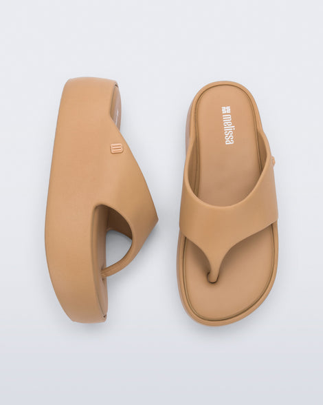 Side and top view of a pair of green Free Platform Thong flip flops