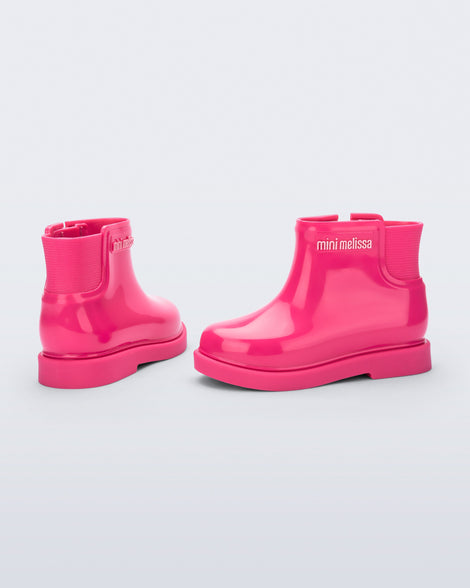 Back and side view of a pair of pink Chelsea II baby boots