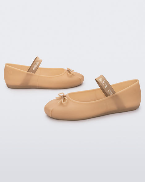 Angled view of a pair of Melissa Sophie ballet flats in black with M-logo strap and bow applique