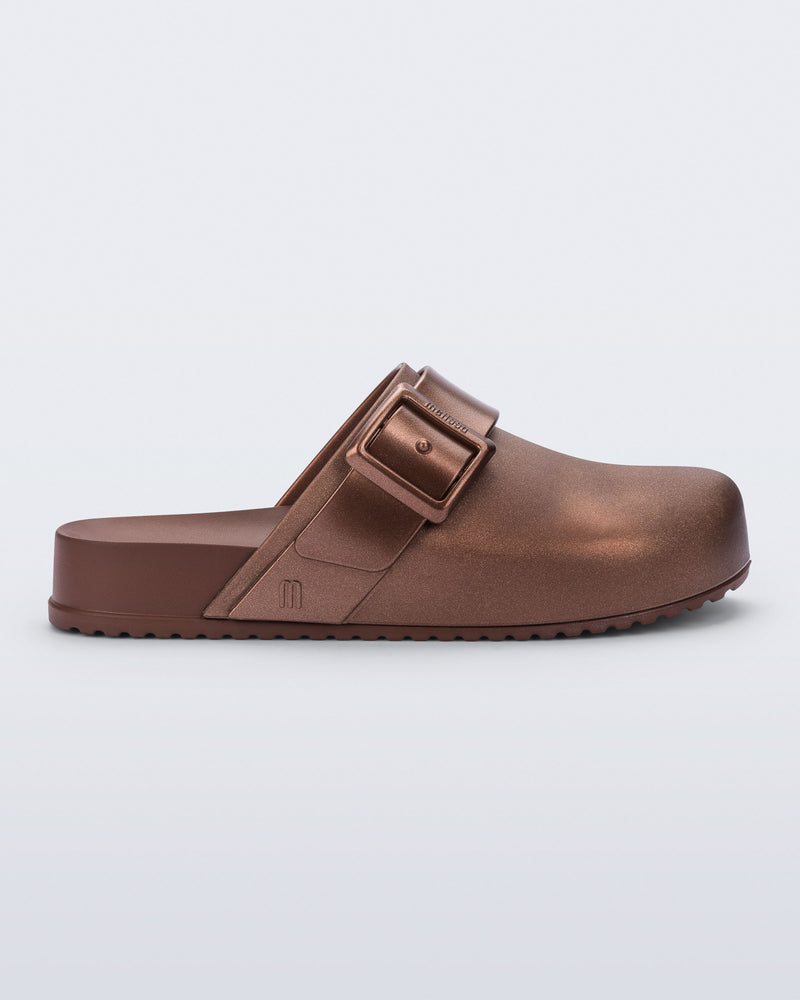 Side view of a copper Cozy Clog with buckle decoration