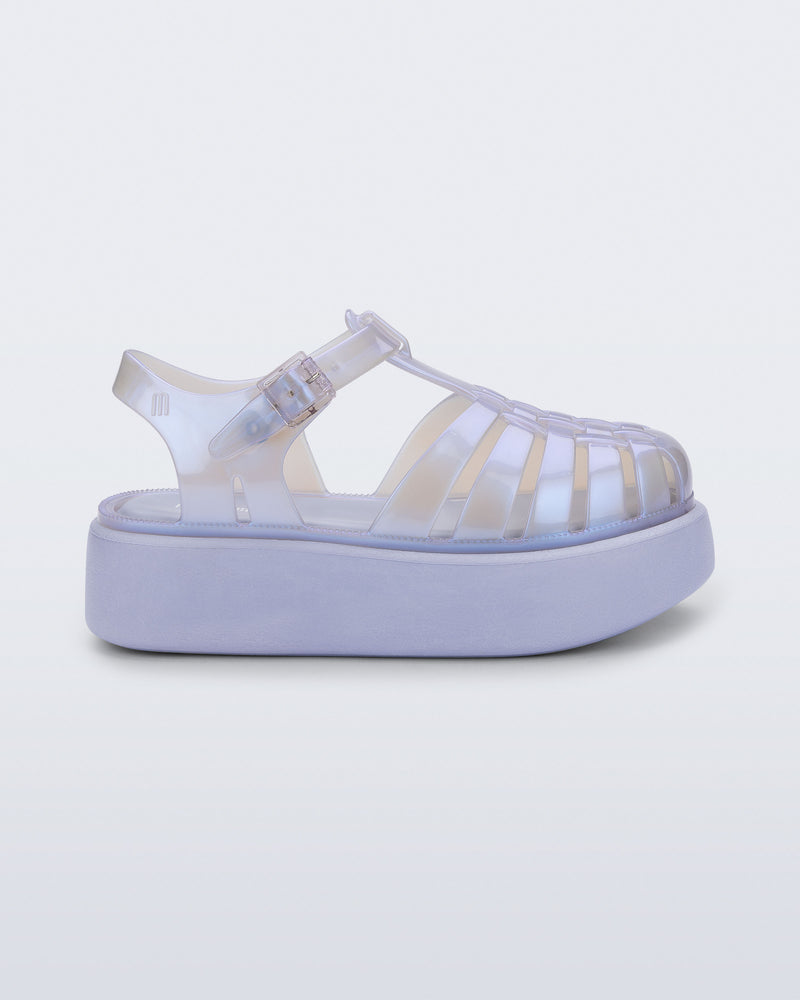 Side view of a pearly blue Possession Platform kids fisherman sandal with lilac sole