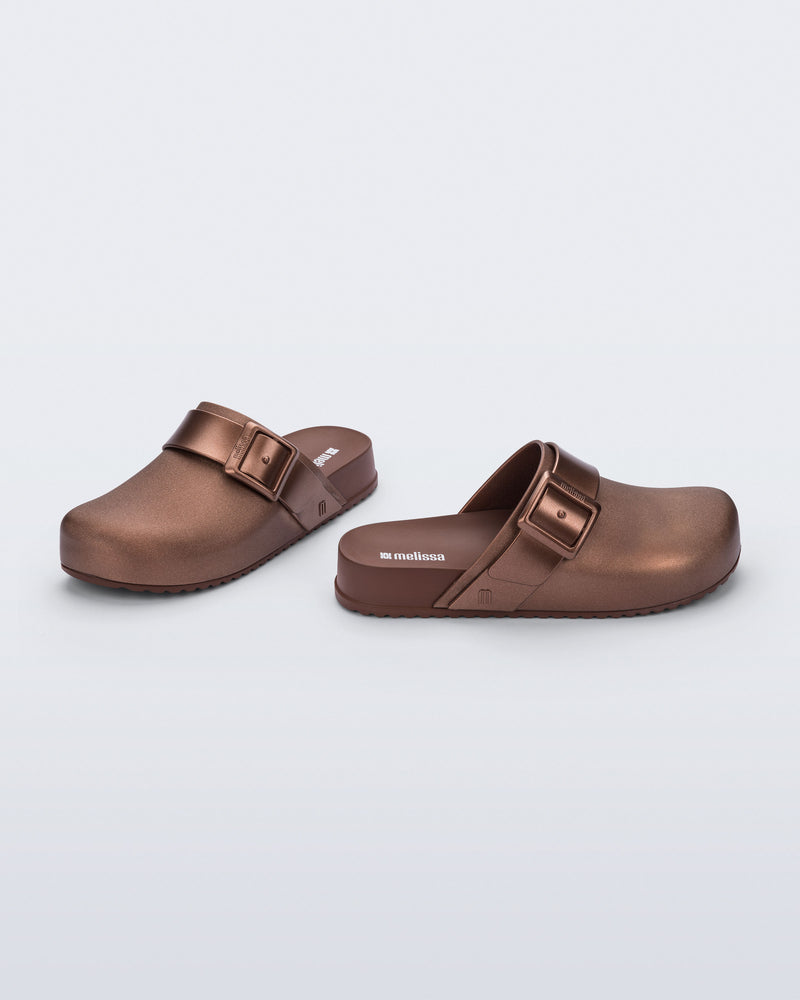 Side and angled view of a pair of copper Cozy Clog with buckle decoration