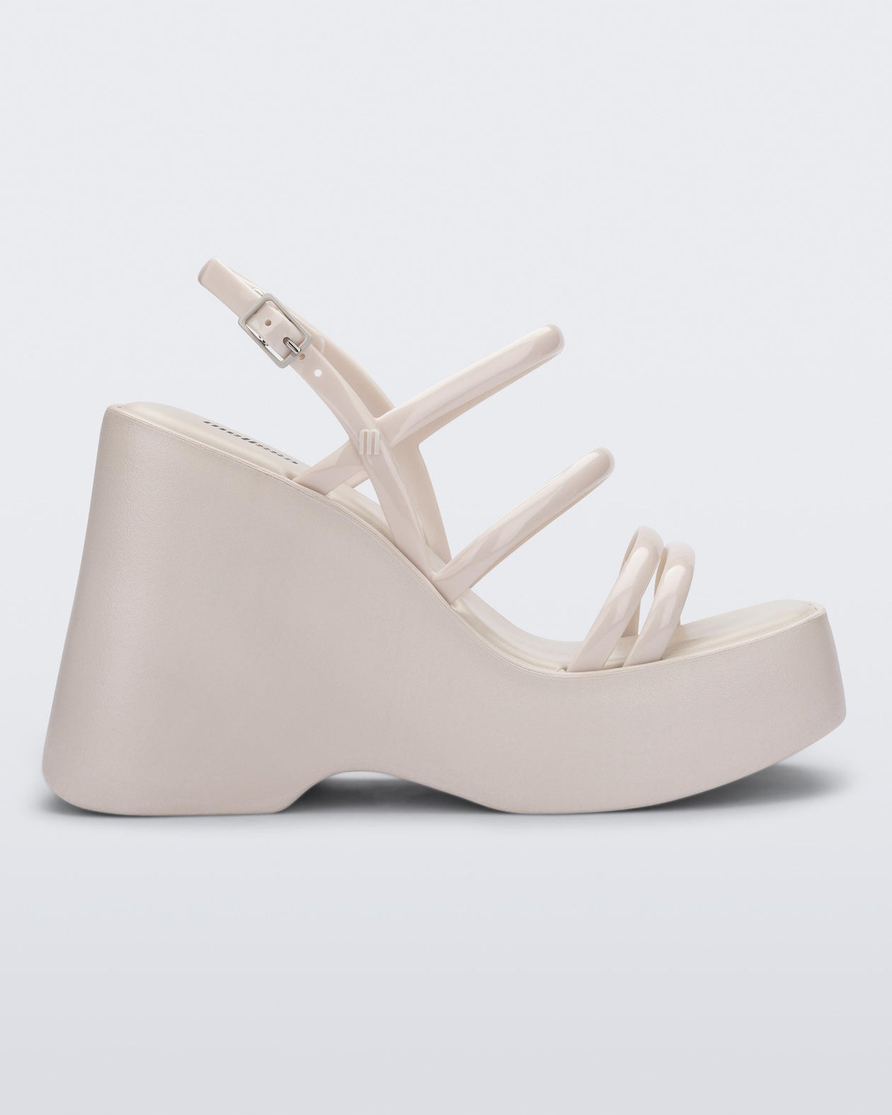 Side view of a white Jessie platform wedge sandal with side buckle ankle strap