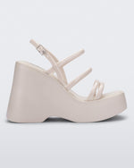 Side view of a white Jessie platform wedge sandal with side buckle ankle strap